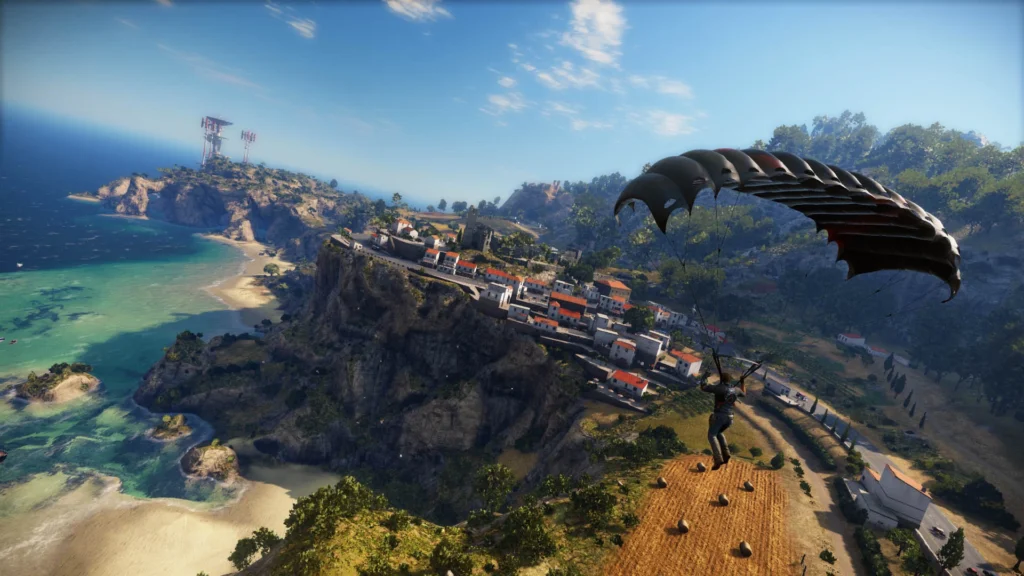 Just Cause 3 com o protagonista Rico Rodriguez planando no ar de braços abertos usando seu traje planador (wingsuit), com explosões e um caça militar ao fundo.